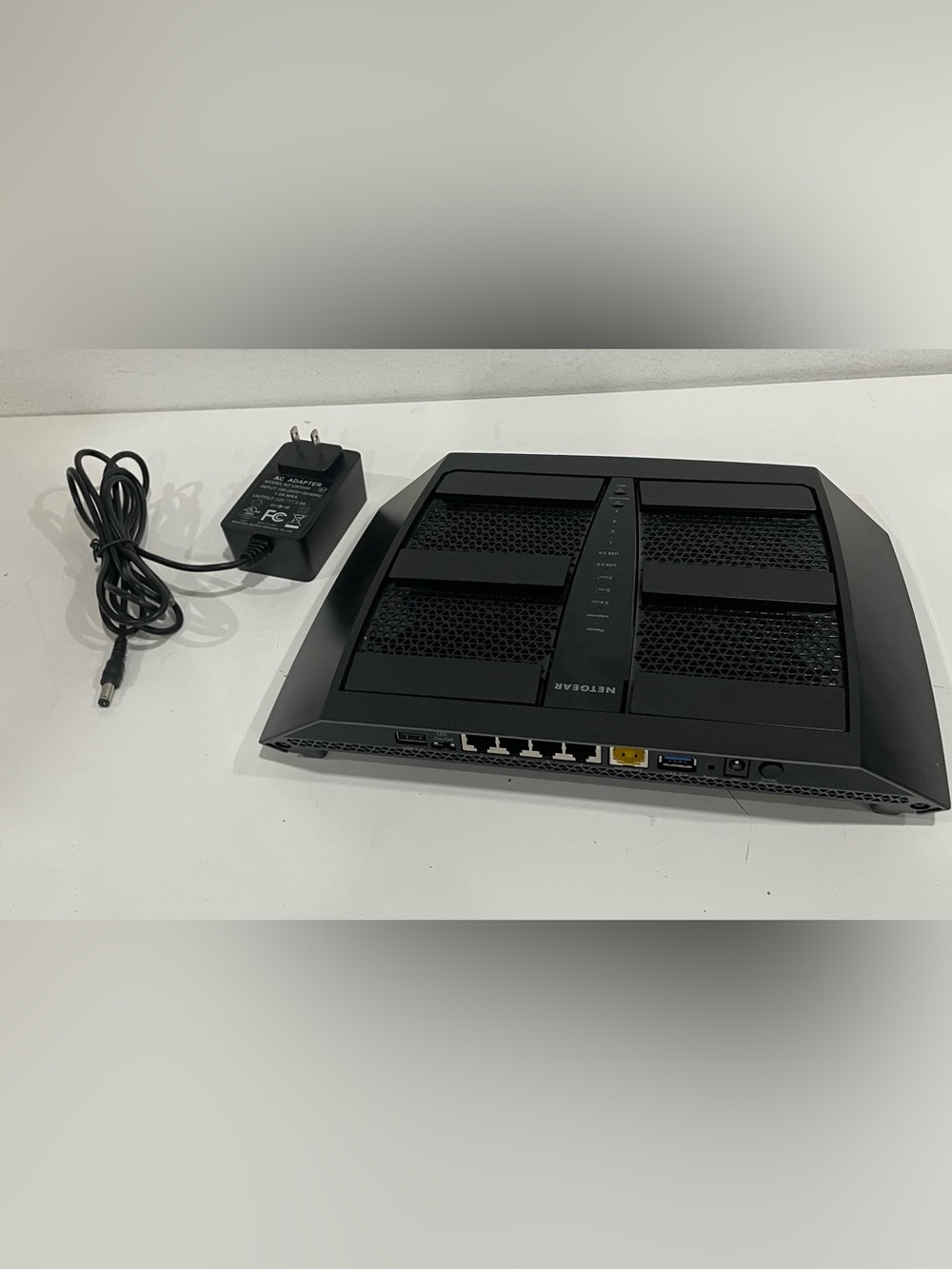 NETGEAR Black Tri-Band WiFi Router with Power Adapter
